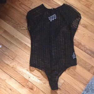 Black mesh caged bodysuit.